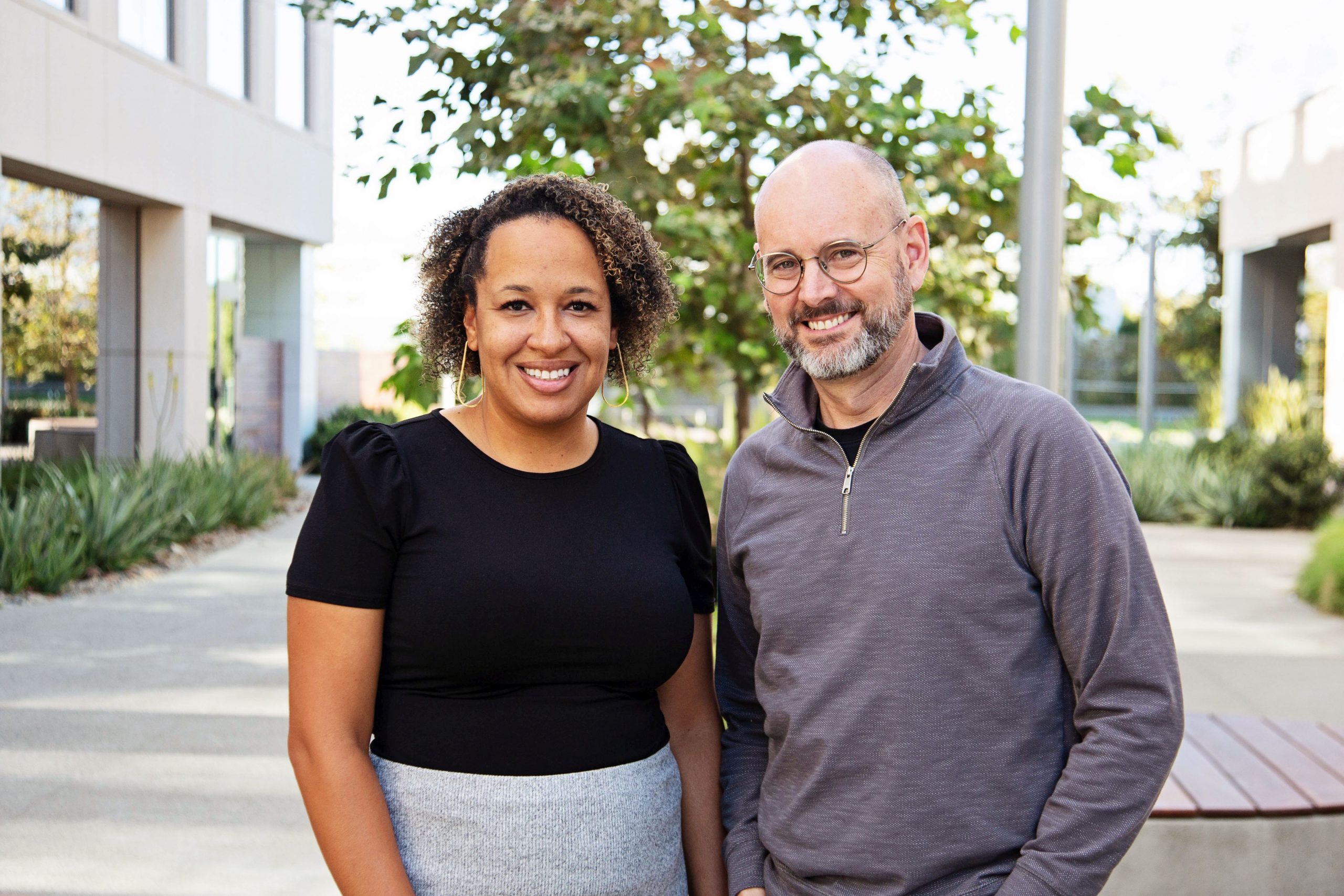 Headshot of two people standing next to each other